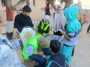 أطفال القليوبية يزينون وجوههم بأعلام مصر وفلسطين في قافلة السعادة لحياة كريمة بشبين القناطر