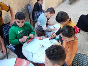 أطفال القليوبية يزينون وجوههم بأعلام مصر وفلسطين في قافلة السعادة لحياة كريمة بشبين القناطر